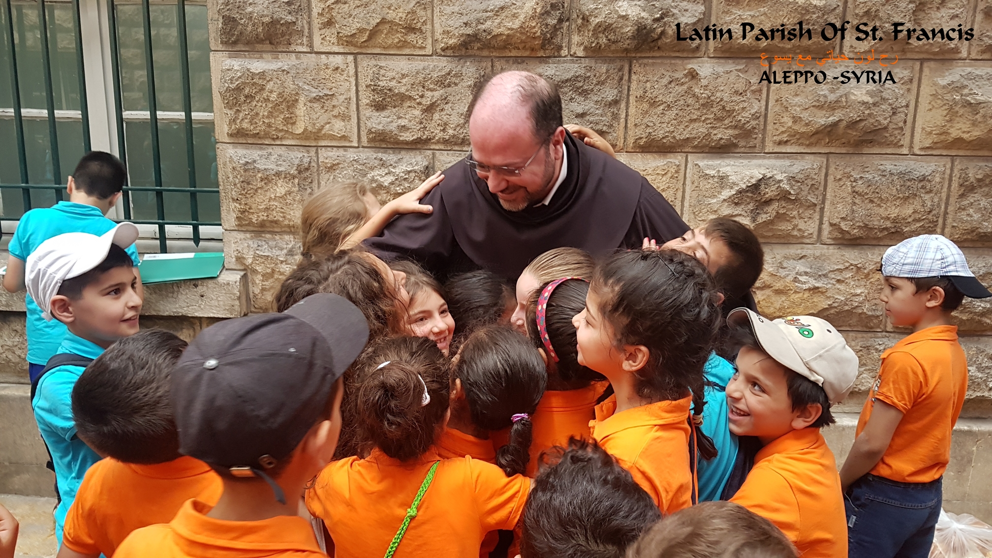 The children of the Latin parish St. Francis of Aleppo with the parish priest  Fr. Ibrahim Alsabagh