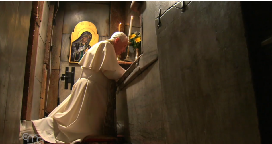Pope Benedict XVI praying inside the Holy Sepulchre during his visit to the Holy Land in 2009