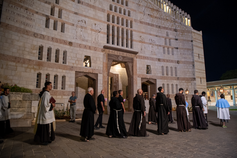 Franciscan friars during the "aux flambeaux" procession in Nazareth