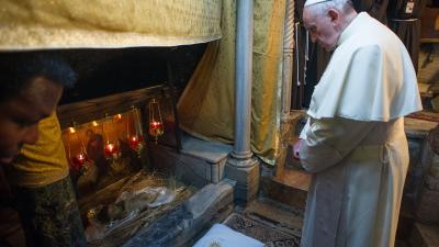 Pope Francis in the Nativity Grotto in Bethlehem, during his pilgrimage to the Holy Land in 2014, © Vatican Media