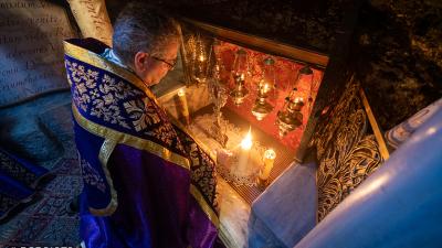Fr. Francesco Patton, Custos of the Holy Land, lights the first candle at the Grotto of Bethlehem