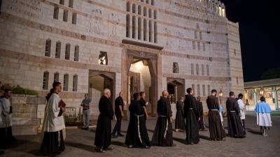Franciscan friars during the "aux flambeaux" procession in Nazareth